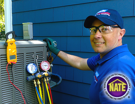 Betlem HVAC Technician Using A Meter On A Furnace - Cover Off Furnace