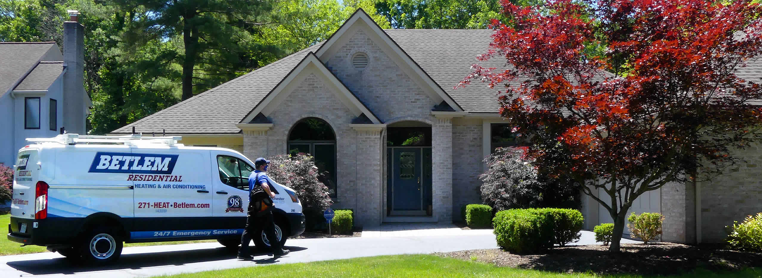 Betlem HVAC Technician Walking From Van To Home Front Door