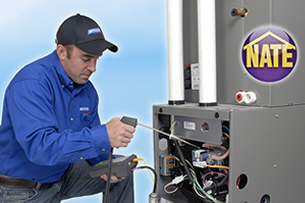 Betlem HVAC Technician Testing A Furance With A Metering DEvice